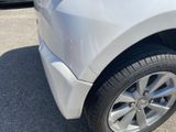 a close up of a car ' s tire on the pavement