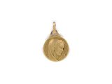 a close up of a gold coin with a woman ' s face on it