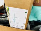 a cardboard box filled with assorted items on a table