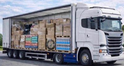 a truck with a trailer full of boxes on the back