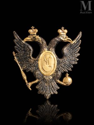 a close up of a gold eagle with a crown on it ' s head