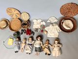 a lot of dolls that are sitting on a table