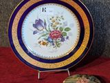 a plate with a clock on it next to a box