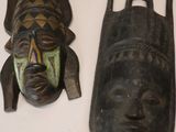 many different types of african masks on a table