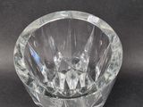 a clear glass vase that is sitting on a table