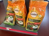 two bags of soup sitting on a shelf in a store