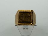 an image of a gold signet ring with the letter r on it