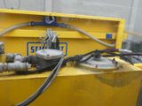 a yellow box with a bunch of hoses attached to it