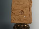 a brown bag with a pair of glasses on top of it