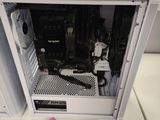 a computer case with a keyboard and mouse on the table