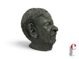 a statue of a man with a mustache on a white background