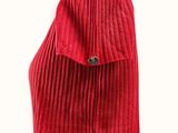 the red sweater has a button on the front of it