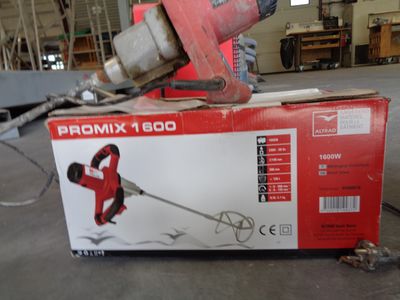 a box that has a red and black tool in it