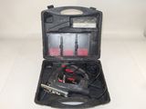 a black case with tools in it on a white surface
