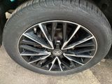 the tire of a car with a flat tire on the ground