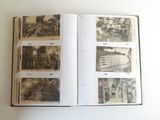 an open book on a table with pictures of people