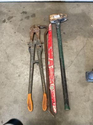 a lot of tools that are laying out on the floor