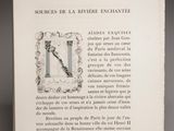 an open book with a picture of a bird on it