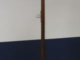 a coat stand with a coat rack in the middle of it