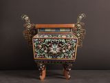 an ornately decorated wooden stand with a book on top of it