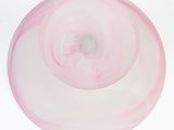underside view of a pink glass bowl with a white background
