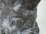 a statue of a man with a beard on a pedestal