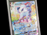 a pokemon card in a plastic holder on a black background