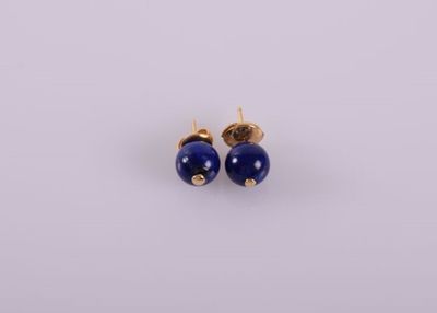 a pair of earrings with blue beads on a white background