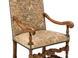 une image d'une chaise avec un dossier et des accoudoirs tapissés de fleurs