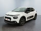 a white citrole is parked in a white room