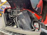 a small engine in the back of a truck