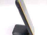 an image of a close up of a cell phone on a stand