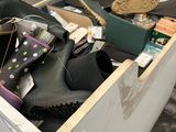 a box full of shoes and a pair of shoes in it