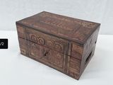 a small wooden box that is sitting on a table