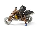 a sculpture of a motorcycle with a bunch of shoes on it