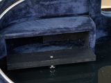 an image of a blue couch with a mirror on the floor