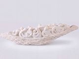 a small white bowl with a group of people in it