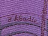 the back of a purple shirt with a picture of the eiffel tower in the background