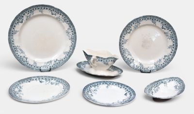 a group of blue and white plates and bowls