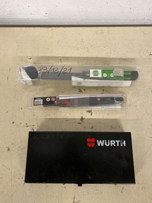 two pens and a pen holder on a table