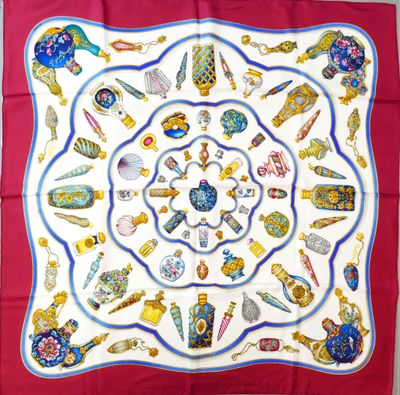 a picture of a square scarf with various items on it