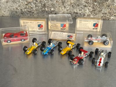 many different types of toy cars in a display case
