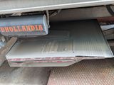 a truck with a box on the back of it ' s bed