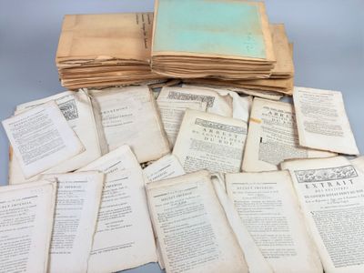 several old books stacked on top of each other on a table