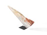 a sculpture of a triangular shaped object on a black stand