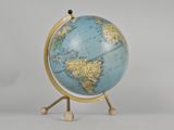 a small blue and gold globe on a stand