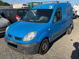 a blue van that is parked in a parking lot