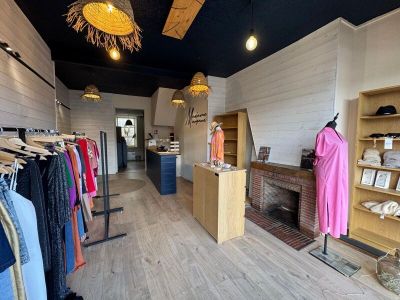 an image of a clothing store with clothes on display