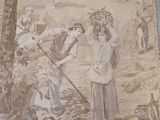 a tapestry with a picture of a woman and a man in a field