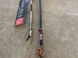 two ski poles laying on the ground next to each other